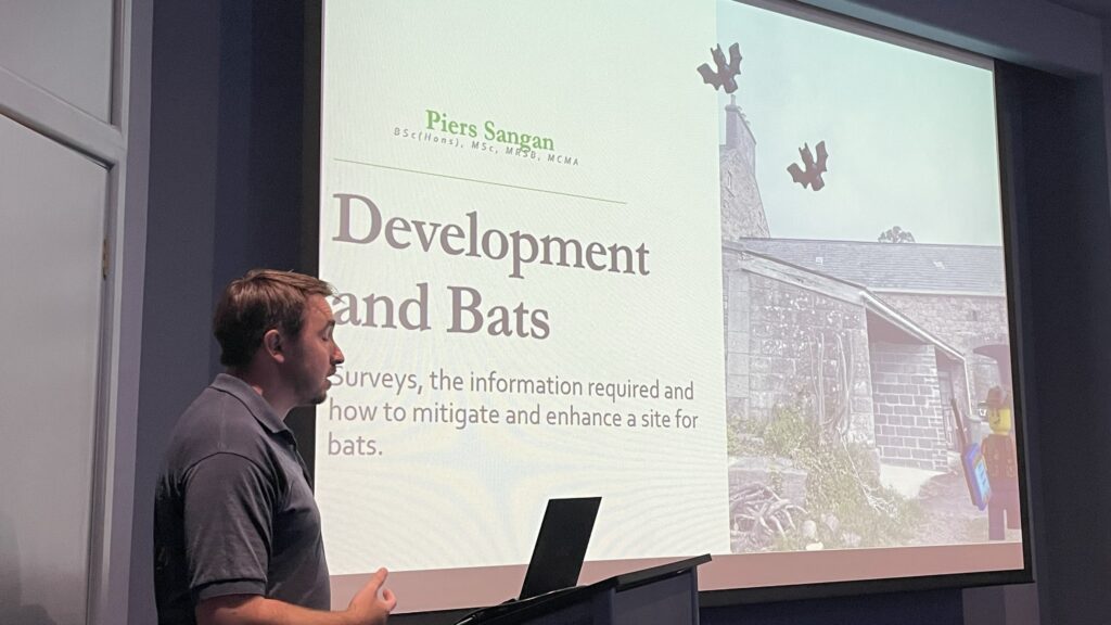 Person presenting on development and bats